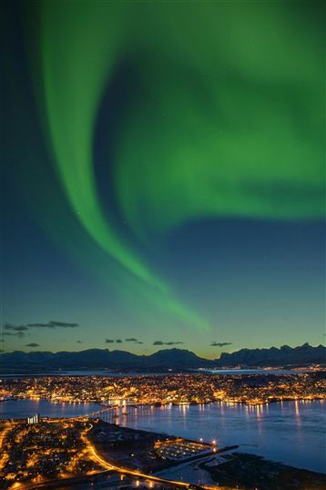 Tromso under the Aurora. Photo Bard Loken/Innovation Norway